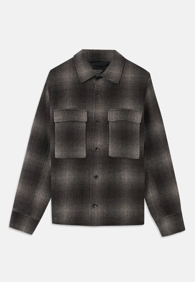 Dark gray and black plaid button-up jacket with pointed collar and two large flap pockets on chest, long sleeves, and straight hem.