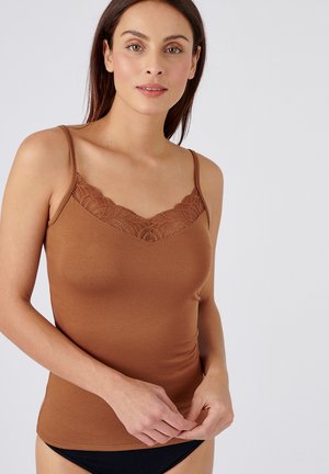 Brown tank top with adjustable straps, featuring a lace detailing along the neckline, slim fit, and soft texture. Accented with a plain base.