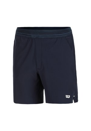 Navy blue sports shorts made of lightweight fabric with a mesh waistband, side pockets, and a white logo on the lower left leg.