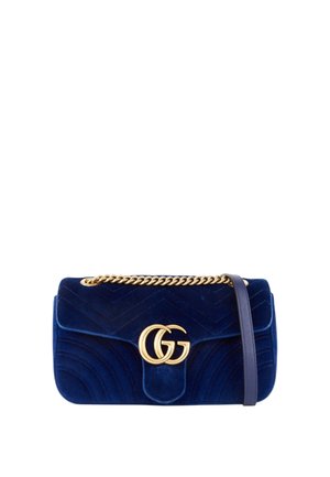 Blue velvet shoulder bag with gold chain strap and gold interlocking double G logo on front flap closure.
