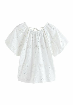 Bluza albă din bumbac cu broderie ochi de copilaș, mâneci scurte largi, decolteu adunat și o mică fundiță în spate.