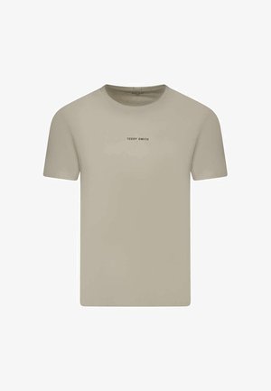 T-shirt beige uni à manches courtes avec col rond et petit texte centré "TEDDY SMITH" sur la poitrine.