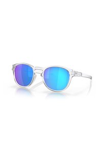 Occhiali da sole con montatura in plastica trasparente e lenti a specchio blu-viola. Forma rotonda con dettagli geometrici sottili sulle aste.