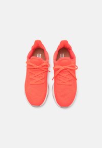 Bright neon orange athletic shoes with a breathable mesh upper, lace closure, cushioned sole, and textured detailing.