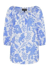 Valkoinen paita, jossa on sininen kukkakuosi, pyöreä pääntie, puffatut kolmipaneliset hihat ja pehmeä kankaan tekstuuri.