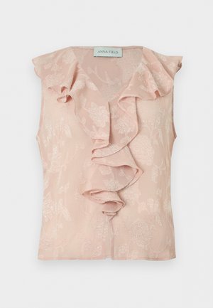 Bluza fără mâneci, roz pal, cu model jacquard floral și detaliu de volane în cascadă de-a lungul părții din față și a decolteului.