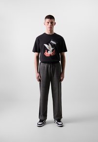 Puma RELAXED TRACK PANTS - Trainingsbroek - black/alpine snow