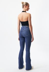 Dr.Denim MOXY FLARE - Flared jeans - cape dark plain