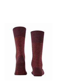 Calzini al ginocchio color bordeaux realizzati in cotone testurizzato, con parte superiore a coste e una sezione centrale decorata con un design sottile.