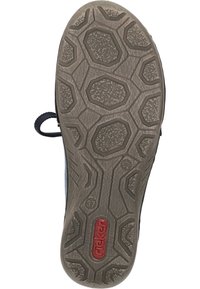 Dark blue sneaker sole featuring a textured, rubber surface with hexagonal patterns, a red logo, and a rounded heel for improved grip.