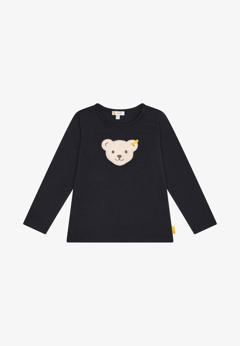 Langärmliges, navyfarbiges Hemd aus Baumwolle mit einer cremefarbenen Bärenkopf-Applikation auf der Brust und einem kleinen gelben Etikett an der Seite.