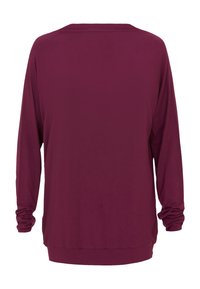 Bordeaux lange mouw top met een relaxte pasvorm, voorzien van een ronde halslijn en gathermouwen. Zacht materiaal met een gladde structuur.