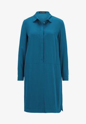 Abito casual teal con colletto a bottoni, maniche lunghe e silhouette dritta con cucitura in vita e spacco laterale. Realizzato in tessuto morbido.