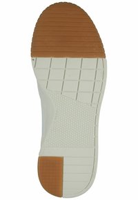 Semelle de chaussure en caoutchouc avec une base blanche texturée et un motif hexagonal marron. Comprend des rainures horizontales pour l'adhérence et une section de tête arrondie.