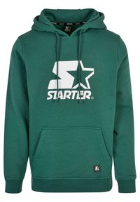 Ciemnozielona bluza z kapturem wykonana z mieszanki bawełny, z dużym białym logo "STARTER" z gwiazdką, przednią kieszenią kangurką i ściągaczami przy rękawach.