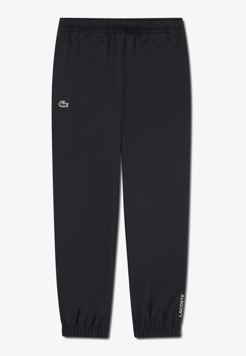 Black athletic pants made of lightweight fabric, featuring an elastic waistband, cuffed ankles, and a small green Lacoste logo on the side.
