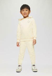 s.Oliver JOGGING MIT KLEINEM PRINT DETAIL - Trainingsbroek - helles sand