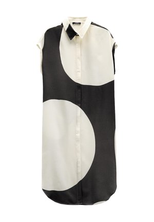 Koszula krótko rękawowa, zapinana na guziki, w jasnym kremowym i czarnym kolorze z dużymi geometrycznymi okręgami. Gładki, lekki materiał, zaokrąglony dół.