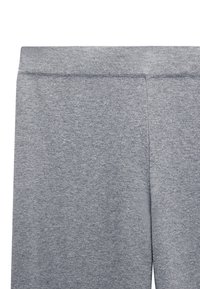 Szare, miękkie legginsy z gładkiego materiału, z szerokim pasem i minimalnymi szwami dla komfortu.