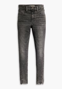 Černé džíny z denimu s vysokým pasem, úzkým střihem a bočními zipy na lemu pro zvýraznění detailů. Obsahují klasický design s pěti kapsami a mírné vyblednutí.