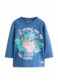Kék, hosszú ujjú pulóver, amelyen mesefigurák, dinoszauruszok és George Malac látható. A felirat: "GEORGE ÉS A DINOSZAURUSZAi!" egy címkével az alján.