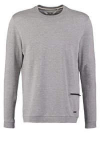Sweat-shirt gris clair à manches longues avec col rond, poignets et ourlet côtelés, doté d'une petite poche à fermeture éclair horizontale en bas à droite.