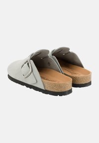 Light gray slip-on shoes with a suede-like texture, featuring a round toe, adjustable metal buckle, and a cork and rubber sole.
