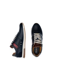 Blue leather sneakers with a red stripe, featuring beige laces, brown accents, and a textured side panel. Rubber sole provides traction.