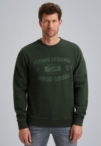 Donkergroene sweatshirt met ronde hals en lange mouwen. Voorzien van een bedrukte logo en tekst aan de voorkant. Gemaakt van een gestructureerde stof.