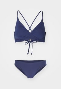 Completo bikini blu navy con top incrociato e chiusura a fiocco, abbinate a slip a vita alta. Tessuto liscio.