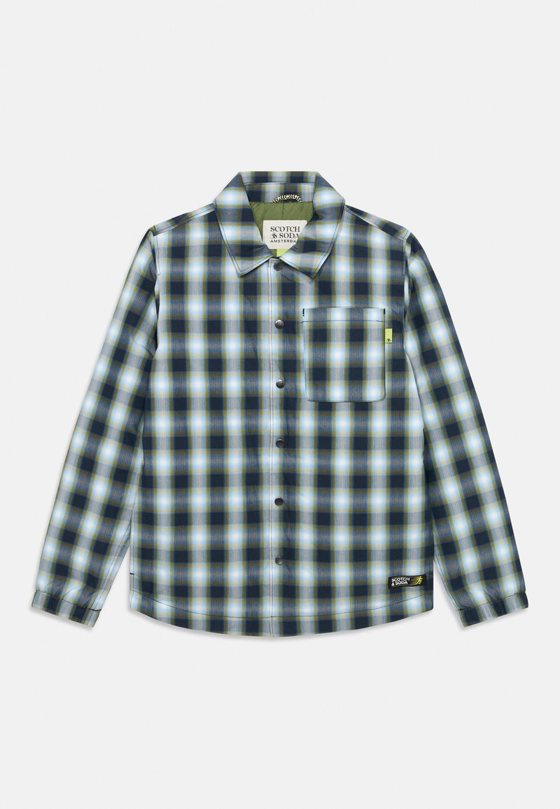 Checkered button-up shirt in navy, light blue, and white. Features a chest pocket and logo tag at the hem. Made from lightweight fabric.