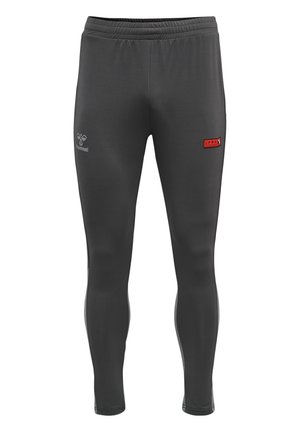 Dark gray slim-fit sports leggings with elastic waistband, Hummel logo on left thigh, and a small red "PRO" patch on right thigh.