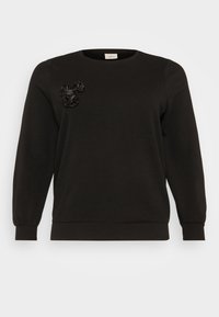 Black sweatshirt with a round neckline and long sleeves, featuring textured fabric and floral appliqué detail on the chest.