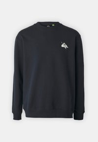 Svart sweatshirt i bomullsmaterial, med rund halsringning, långa ärmar och en liten vit grafik på bröstet.