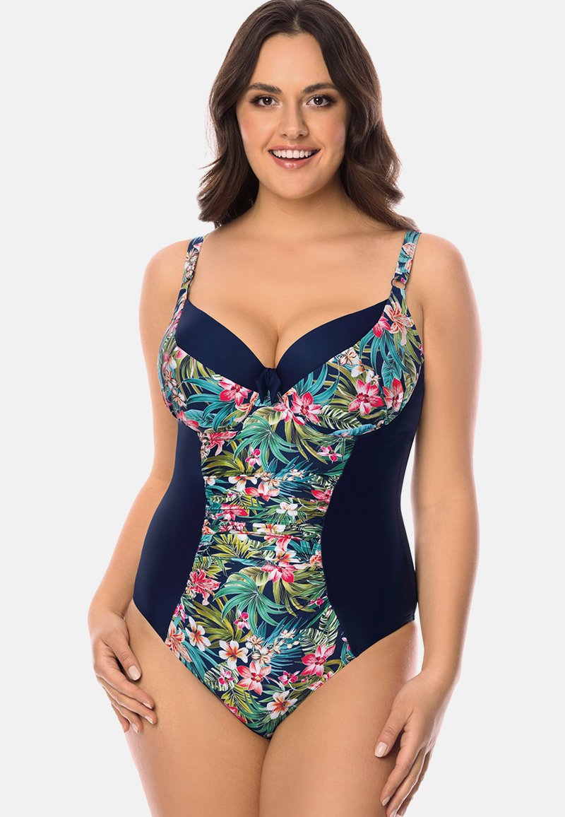 Enhetssvimsuit med marinblå botten och ett blommönster med rosa blommor och gröna blad på toppen. Justerbara axelband och rosett-detalj.