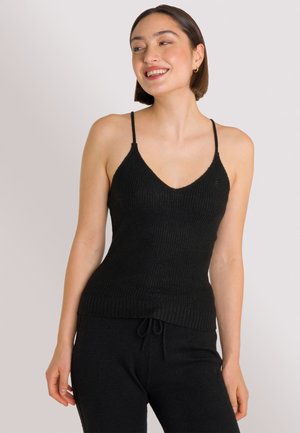 Schwarzes geripptes Strick-Tanktop mit V-Ausschnitt, dünnen Trägern und taillierter Passform. Weiche Textur mit einem etwas längeren Rückensaum für zusätzlichen Komfort.