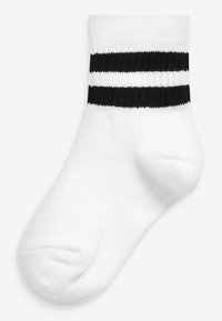 Chaussette en coton blanc avec deux rayures noires en haut, texture côtelée et design à bout rond.