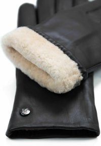 Black leather gloves with a cream-colored fur lining. Features a smooth texture and a metallic button accent.