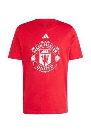 Röd bomullströja med en framträdande vit Manchester United-logotyp och Adidas-logotypen på den övre framsidan. Korta ärmar, rund halsdesign.