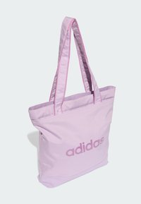 Ibolyaszínű válltáska dupla vállpánttal, sima felülettel és egy sötétebb ibolyaszínű "adidas" logóval.