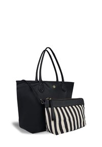 Black leather tote bag with braided handles, paired with a smaller striped black and cream pouch, featuring a zipper closure.