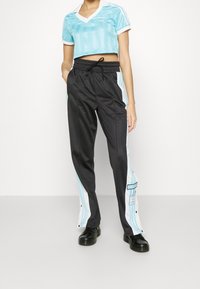 adidas Originals Träningsbyxor - black