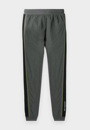 Gray athletic pants with a black side panel and a green accent stripe. Elastic waistband and cuffed hems. Lightweight, smooth texture.