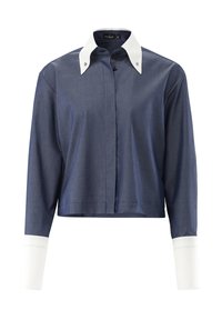Cropped button-up shirt in dark blue fabric, featuring a contrasting white collar and cuffs with decorative stitching. Full-length sleeves.