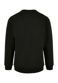 Felpa nera con maniche lunghe, scollatura rotonda e polsini a coste. Realizzata in un tessuto morbido e testurizzato con una finitura in un colore solido.