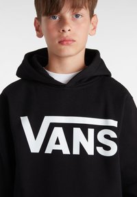 Sweat à capuche noir avec le logo "VANS" blanc, en mélange de coton. Il dispose d'une poche frontale et d'une capuche avec cordon de serrage réglable. Texture lisse.