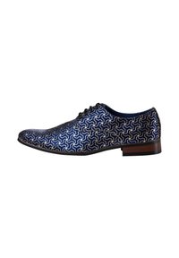 Blue patterned dress shoe with a geometric design, leather material, laced upper, and a wooden heel. Features intricate white stitching.