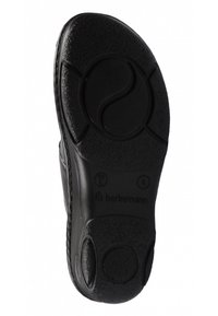 Black rubber shoe sole with textured grip patterns, circular design elements, and brand logo. Features dual cushioning dots for comfort.