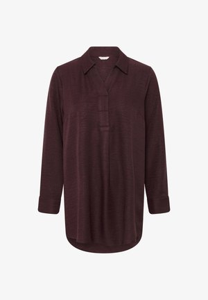 Bordeauxfarbene Bluse mit langen Ärmeln, Kragen, dezenter Knopfleiste und abgerundetem Saum; aus strukturiertem Stoff mit umgeschlagenen Manschetten.