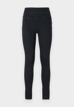 Zwarte denim leggings met een hoge taille, twee zijzakken, zachte textuur en minimale stikseldetails. Geschikt voor casual draag.